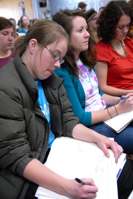 Art majors Paige Ward, junior, Kelsey Nagy, sophomore, and Rebekah Frost, junior, sketch and listen during the ceramics workshop given by Mark Shapiro. - Photo by Kristi McMurry Woody