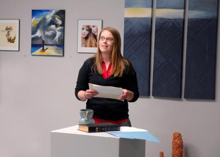 Paige Ward, junior art major, thinks about what to say after receiving the Bezelel Scholarship, which is the highest award given to an art student.  - Photo by Kristi McMurry Woody