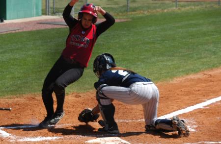 Brooke Laws tries to avoid the tag at homeplate. - Photo by Steven Aldridge