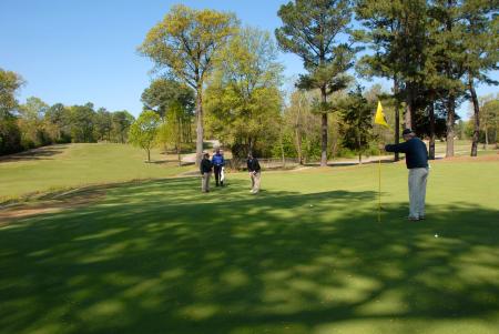 Bob Campbell takes a long putt during Union's first Golf & Gala golf tournament. - Photo by Morris Abernathy