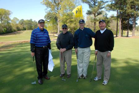 Harold Patrick, John Dancy, Harry Smith and Bob Campbell pose for a photo after finishing a hole at Union's first Roy L. White Golf & Gala golf tournament. - Photo by Morris Abernathy