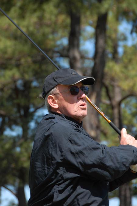 Breakfast speaker John Dancy, former NBC senior correspondent and 1959 Union graduate, follows his ball down the fairway during Union's first Roy L. White Golf & Gala golf tournament. - Photo by Morris Abernathy