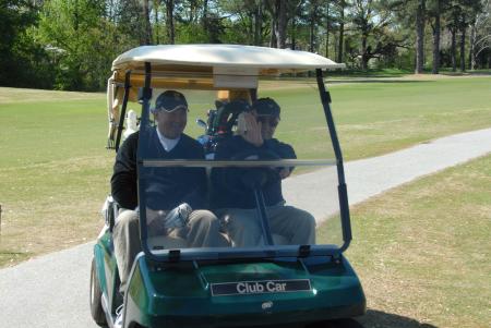 Bob Campbell and John Dancy finish up their round during Union's first Roy L. White Golf & Gala golf tournament. - Photo by Morris Abernathy