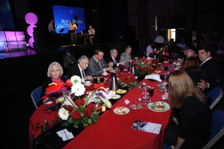 Peyton Manning and the Whites eat dinner just before Manning speaks at the Roy L. White Legacy Golf & Gala gala at the Carl Perkins Civic Center. - Photo by Morris Abernathy
