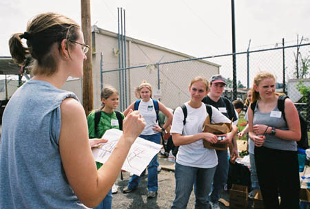 Alum Julie Boyer organizes a group of Union students volunteering their time during the Jackson tornado of May 2003. - Photo by Justin Veneman