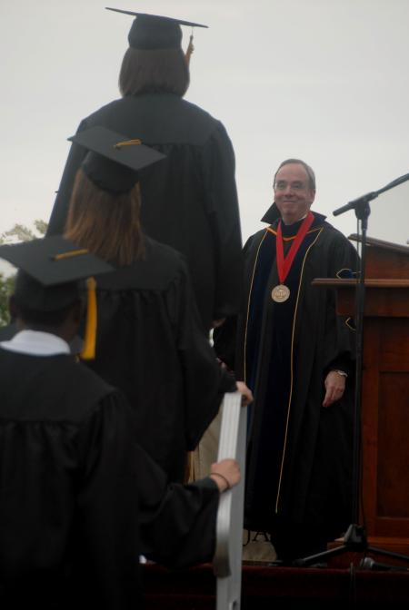 President Dockery hands out diplomas during the spring graduation ceremony. - Photo by Angela Abbamonte