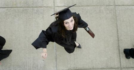 International business graduate Ashley Ennis heads to the Great Lawn for spring graduation. - Photo by Beth Spain