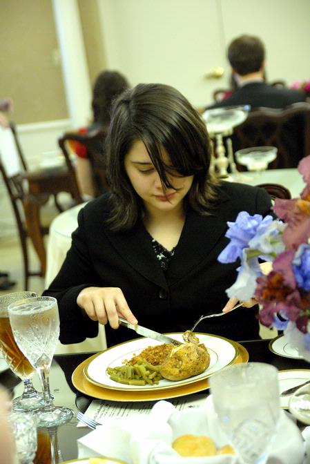 Brandy Hudgins, career services secretary, enjoys the lunch prepared for the 2009 Etiquette Luncheon. At this annual event, First Lady Lanese Dockery and Mrs. Sherry Tignor instruct students on proper interview etiquette. - Photo by Kristi McMurry Woody