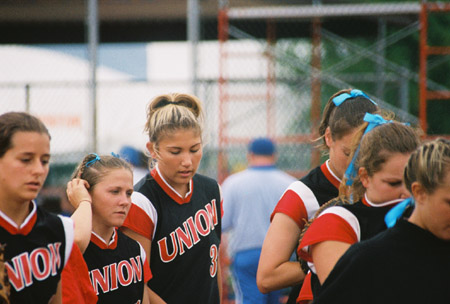 (L to R)Holly Haycraft, Crystal Surgalski, and Amanda Dixon  at the 2003 NAIA Softball World Series in Decatur, Ala. versus the University of Mary. - Photo by Steven Aldridge
