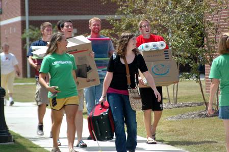 Returning students move into their rooms in the Quads with the help of friends. - Photo by Beth Spain