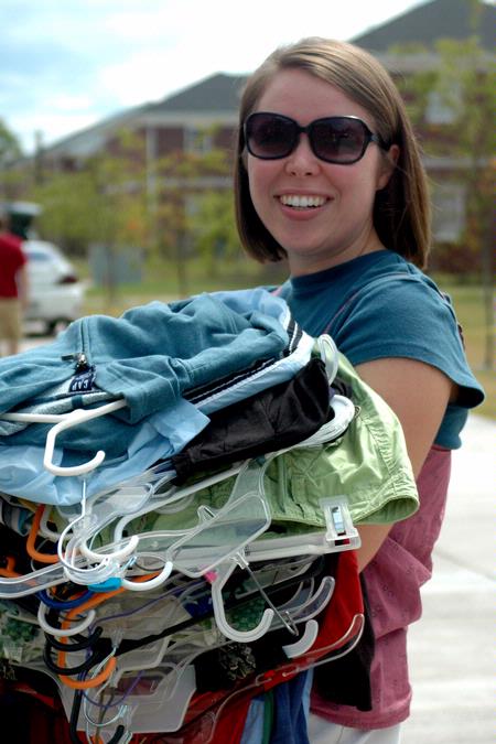 Claire May helps her sister Abigail move into her room in the Quads. - Photo by Beth Spain