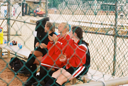 (L to R) Sara Batey, Mary Kosco, and Melissa McCue at the 2003 NAIA Softball World Series in Decatur, Ala. versus the University of Mary. - Photo by Steven Aldridge