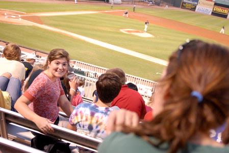 Kristen Voorhies, senior music major, turns around to talk to friends at the Diamond Jaxx game. The Diamond Jaxx hosted a college night, and many faculty and students came out for the game. - Photo by Kristi McMurry Woody