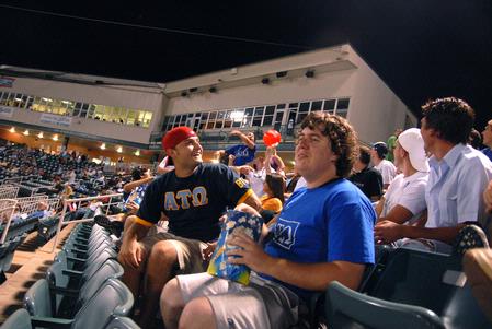 Members of Alpha Tau Omega watch the Diamond Jaxx game and fellowship with friends at Pringles Park on college night.  - Photo by Kristi McMurry Woody