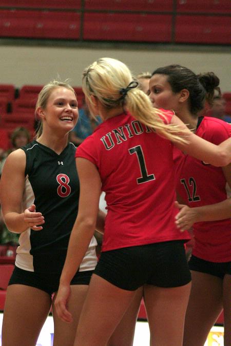The Lady Bulldog volleyball team celebrates a point in their game against Martin Methodist.  The women won this match 3-0. - Photo by Kristi McMurry Woody