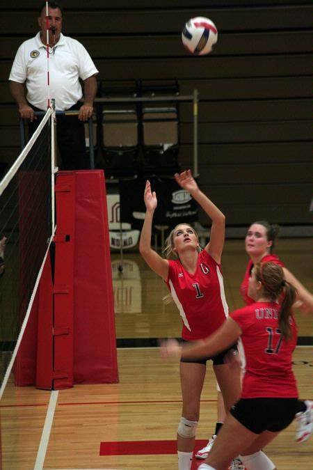 Katie Adams, senior communications major, sets the ball as Anna Sims, sophomore art major, approaches to spike it.  The Lady Bulldogs won this match against Martin Methodist 3-0. - Photo by Kristi McMurry Woody
