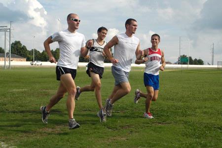 The men's track team runs during practice. - Photo by Sarah Palmer Goff