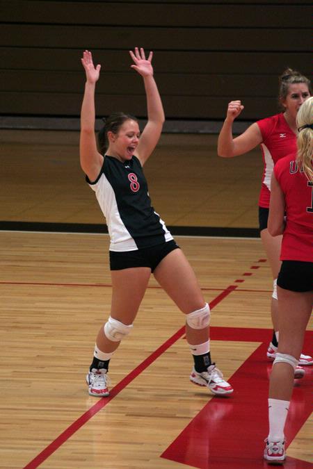 Kacie Ritter, junior, celebrates with her teammates after getting a point against Lyon College. - Photo by Kristi McMurry Woody