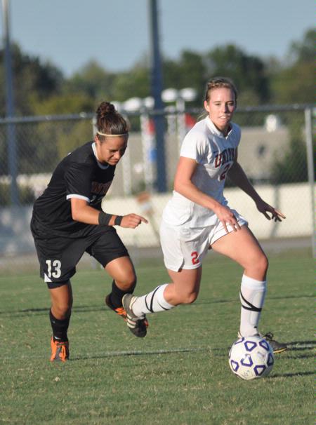 Sara Weir pushed the ball past a Union (Ky.) defender. - Photo by Tommy Sadler