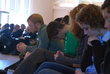 Students pray at a chapel service during the Southern Baptists, Evangelicals and the Future of Denominationalism conference.  - Photo by Abby Ott