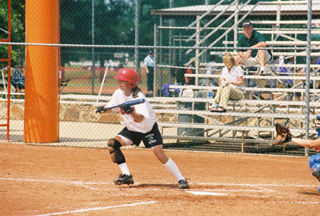 Holly Haycraft of Dyersburg, Tenn. squares to bunt a pitch at the 2003 NAIA Softball World Series. - Photo by Steven Aldridge
