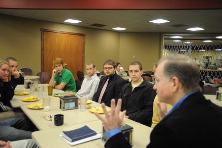 Danny Akin, president of Southeastern Baptist Theological Seminary, talks with students from Union over breakfast who are interested in going to Southeastern. - Photo by Morris Abernathy