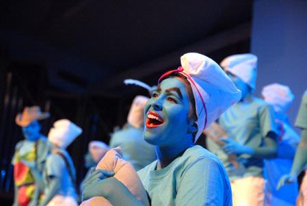 The ladies of Chi Omega perform their large group act, a skit about the Smurfs, during All-Sing 2009. - Photo by Kristi McMurry Woody