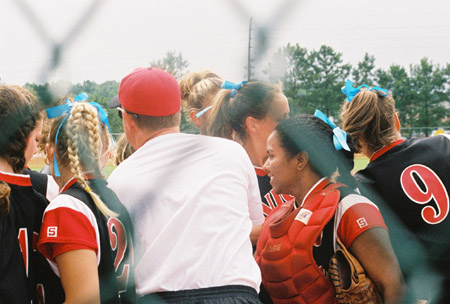 Union head coach Brian Dunn gives a few last minute instructions at the 2003 NAIA Softball World Series.  Decatur, Ala. native and Union's catcher, Megan Quarry, looks on. - Photo by Steven Aldridge