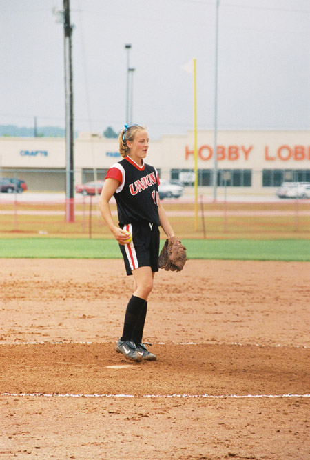 Leah Gronberg of College Station, Texas gets ready to make a pitch at the 2003 NAIA Softball World Series in Decatur, Ala. - Photo by Steven Aldridge