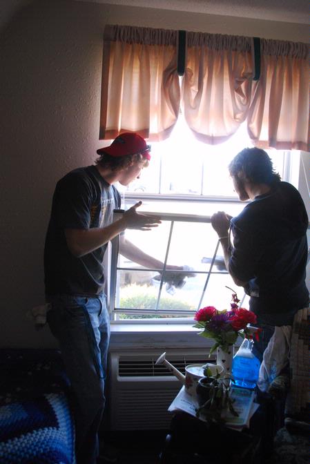 Jake Ryan, freshman undecided major, and Zeke Kurcab, freshman biology major, volunteer at Alexandria Place Assisted Living on the Day of Remembrance.  - Photo by Abby Ott