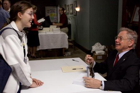 David Hackett Fischer talks with Hannah Morgan, sophomore psychology major, before signing her book at the 13th annual Carls-Schwerdfeger History Lecture Series.  - Photo by Megan Bailey