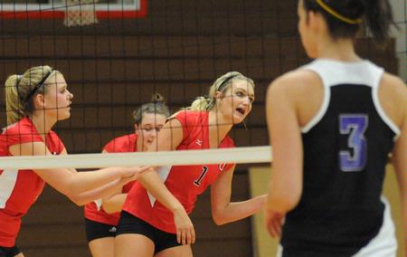 Lauren Sprouse (left) and Katie Adams await the next serve. - Photo by Morris Abernathy