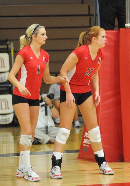 Katie Adams (left) and Anna Sims await the next serve. - Photo by Morris Abernathy