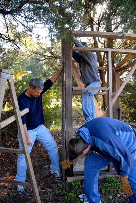 David Thomas, professor of history, helps history students build a replica outhouse at Green Frog Village. This project was part of Union's Campus and Community Day.  - Photo by Kristi McMurry Woody