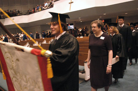 Graduates file in during the processional at the August 2003 commencement exercises held at West Jackson Baptist Church. - Photo by Jim Veneman