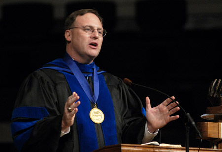 Dr. Michael Spradlin, president of Mid-America Baptist Theological Seminary, presents the August 2003 commencement address entitled, <i>Praying for Results.</i> - Photo by Jim Veneman