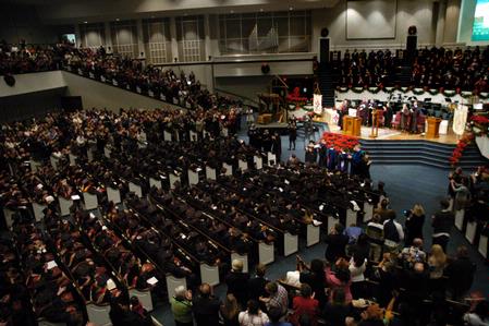 Friends and family stand and applaud the fall graduates. - Photo by Sarah Palmer Goff