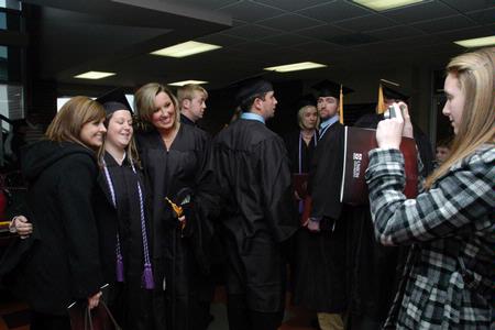 Brandy Welch, Kelly Ward and Hailey Fike get their picture taken together after the fall graduation ceremony. - Photo by Sarah Palmer Goff