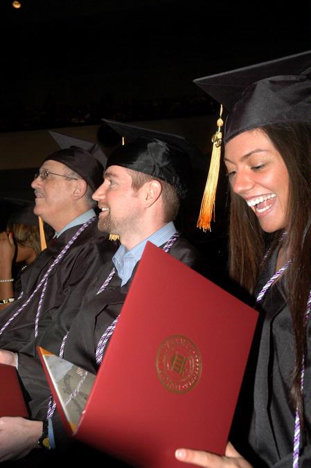 Felicia Castandeda, nursing graduate, happily takes in her diploma during fall graduation. - Photo by Beth Spain