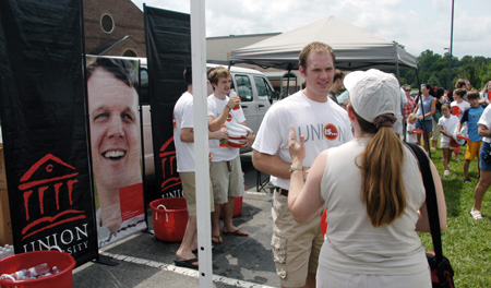 Enrollment counselor Michael Norton talks with a fan at a Steven Curtis Chapman Brown Bag concert sponsored by Union in Franklin, Tenn. - Photo by Jim Veneman