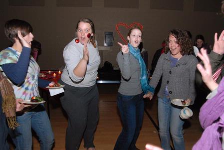 Students have fun singing along to Valentine's Day themed music at the Mugs 'N Kisses event hosted for women students by Residence Life.  - Photo by Kristi McMurry Woody