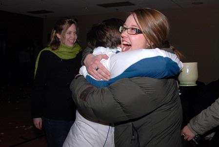 Art students Paige Ward and Kristen Marks greet each other at the Mugs 'N Kisses event hosted by Residence Life.  - Photo by Kristi McMurry Woody