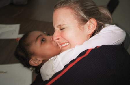 Student Kristin Veach and her GO Boston teammates play with children at an after school program at Metropolitan New Life Baptist Church. - Photo by Uncredited