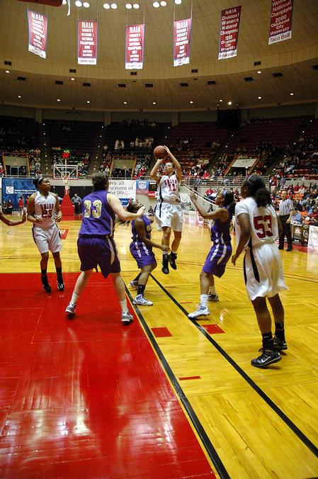 Kaitlin Dudley, senior physical education and health major, goes up for a shot against Southwestern Assemblies of God University in Game 1 of the NAIA Women's Basketball National Tournament. The Lady Bulldogs won 86-47. - Photo by Jordan Buie