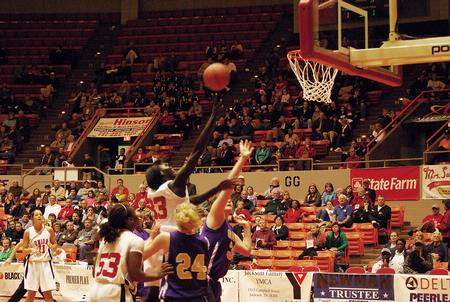 Zeinab Chan, junior history major, goes up for a shot against Southwestern Assemblies of God University in Game 1 of the NAIA Women's Basketball National Tournament. The Lady Bulldogs won 86-47. - Photo by Abigail Harris