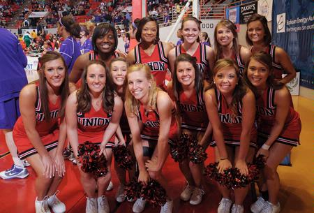 Union's cheerleaders take a break from cheering for the Lady Bulldogs in Game 1 of the NAIA Women's Basketball National Tournament against Southwestern Assemblies of God University. - Photo by Morris Abernathy