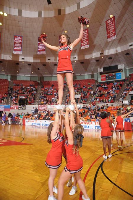 Union's cheerleaders cheer loud for the Lady Bulldogs in Game 1 of the NAIA Women's Basketball National Tournament against Southwestern Assemblies of God University. - Photo by Morris Abernathy