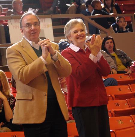 Dr. David S. Dockery, president of Union University, cheers with his wife Lanese Dockery for the Lady Bulldogs in Game 1 of the NAIA Women's Basketball National Tournament against Southwestern Assemblies of God University. - Photo by Morris Abernathy
