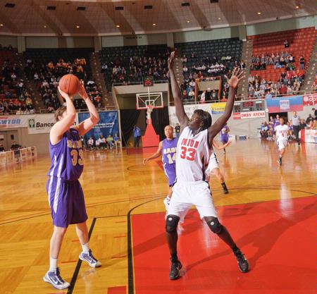 Zeinab Chan, junior history major, defends against Southwestern Assemblies of God University in Game 1 of the NAIA Women's Basketball National Tournament. The Lady Bulldogs won 86-47. - Photo by Morris Abernathy