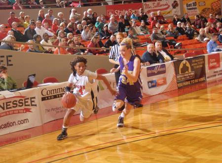 Jessica Graves, senior journalism major, drives to the basket in Game 1 of the NAIA Women's Basketball National Tournament against Southwestern Assemblies of God University. The Lady Bulldogs won 86-47. - Photo by Morris Abernathy